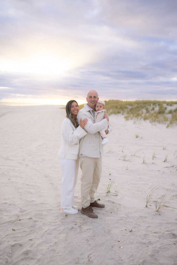 Family beach session capturing natural connection at sunset in Florida
