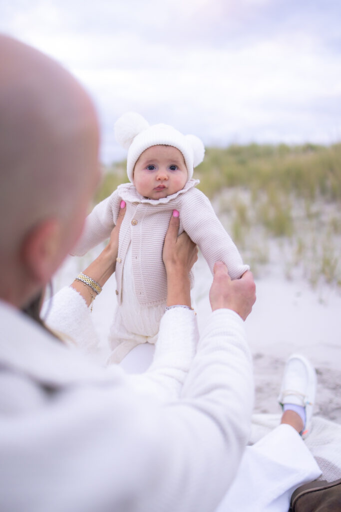 Guided family photography experience with multi-generational portraits at beach