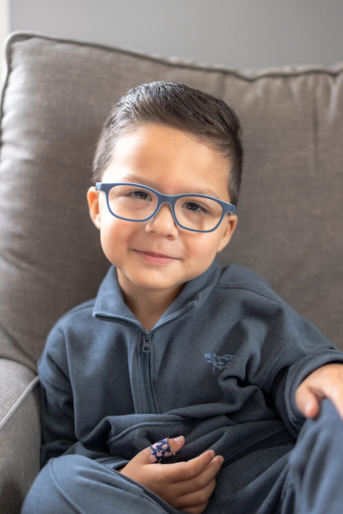 Full-service in-home family photography session capturing connection and comfort