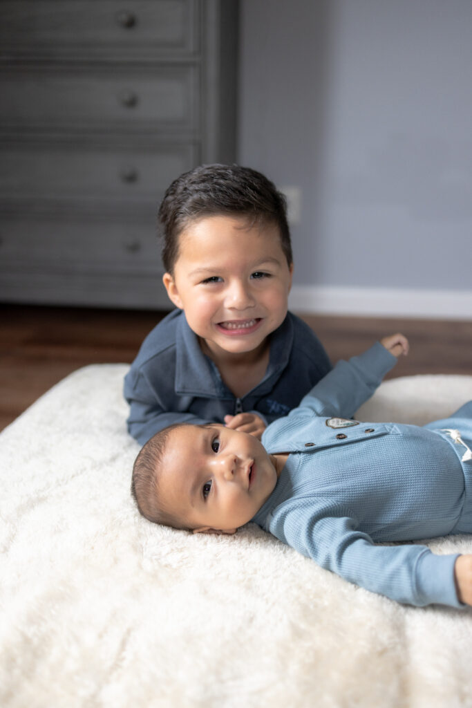 Natural sibling connection captured during in-home newborn session