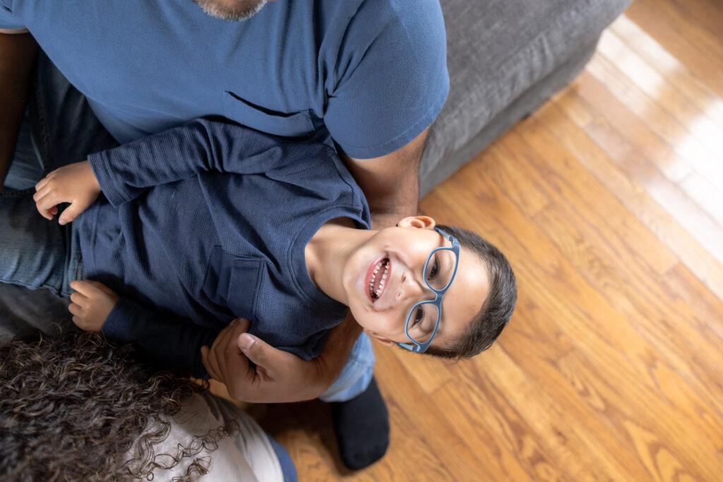Documentary-style family photography showing everyday life with young children